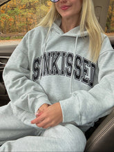 Oversized Grey Varsity Hoodie with Embroidered Sun Motif