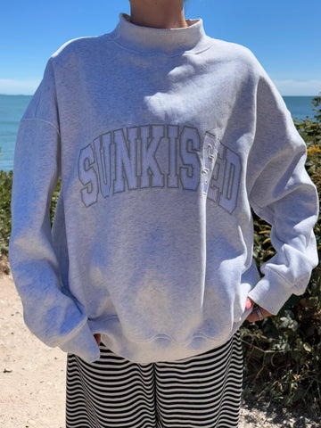 Pearl Grey Mockneck Sweatshirt with Embroidered Varsity Style