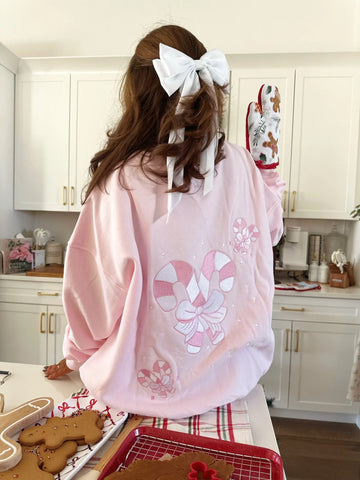 Cozy Light Pink Sweatshirt with Candy Cane Wonderland Print