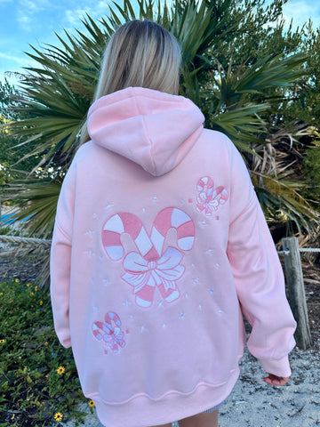Cozy Pink Candy Cane Hoodie for Festive Street Style