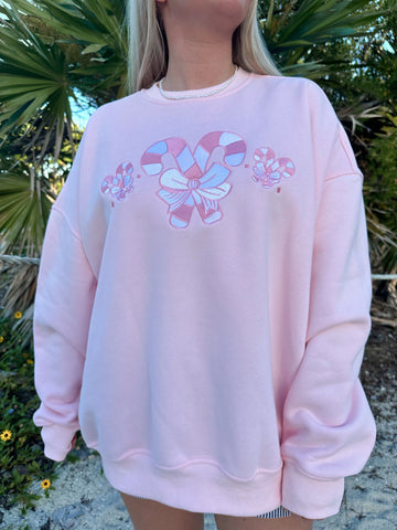 Cozy Light Pink Sweatshirt with Candy Cane Wonderland Print