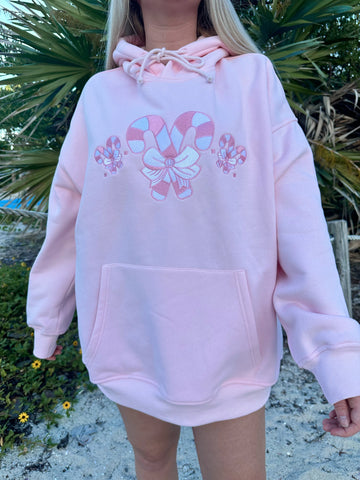 Cozy Pink Candy Cane Hoodie for Festive Street Style