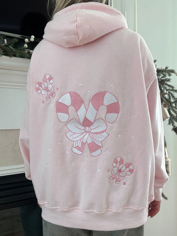 Cozy Pink Candy Cane Hoodie for Festive Street Style