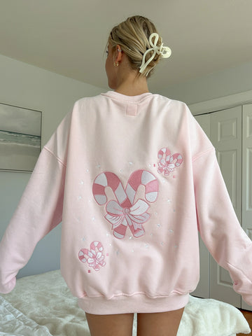 Cozy Light Pink Sweatshirt with Candy Cane Wonderland Print