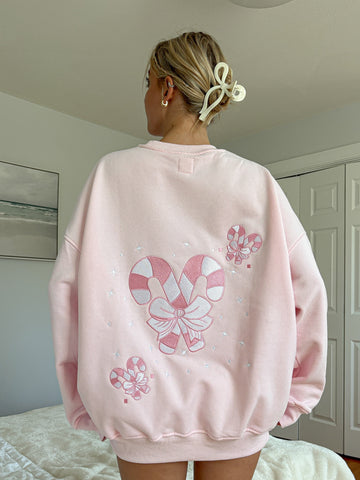 Cozy Light Pink Sweatshirt with Candy Cane Wonderland Print