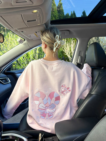 Cozy Light Pink Sweatshirt with Candy Cane Wonderland Print